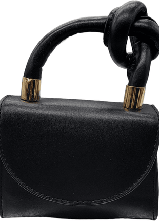 Black leather handbag with a twisted handle and gold accents