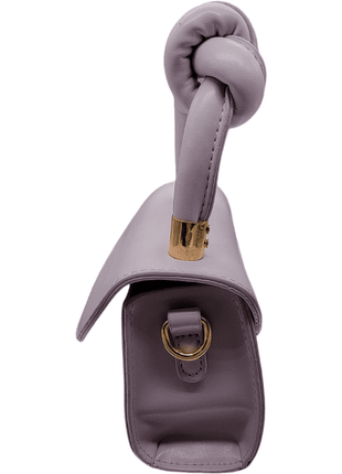 Side view of a lavender handbag with a knotted handle and gold hardware