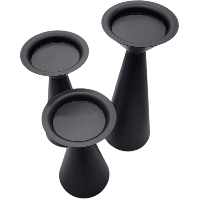 Three black conical candle holders of varying heights