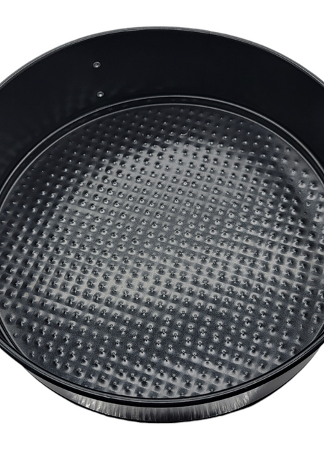 Black non-stick springform cake pan with textured bottom