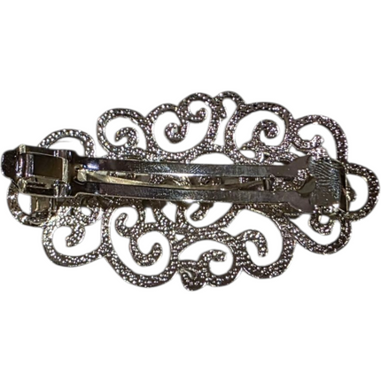 Elegant silver hair brooch with intricate scroll design, 8cm x 4cm x 2cm size.