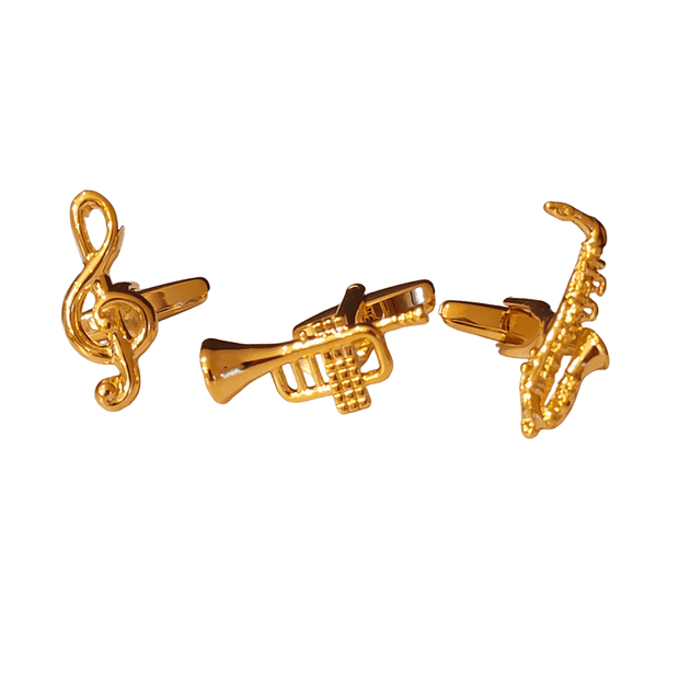 Gold cufflinks in the shape of a treble clef, trumpet, and saxophone.