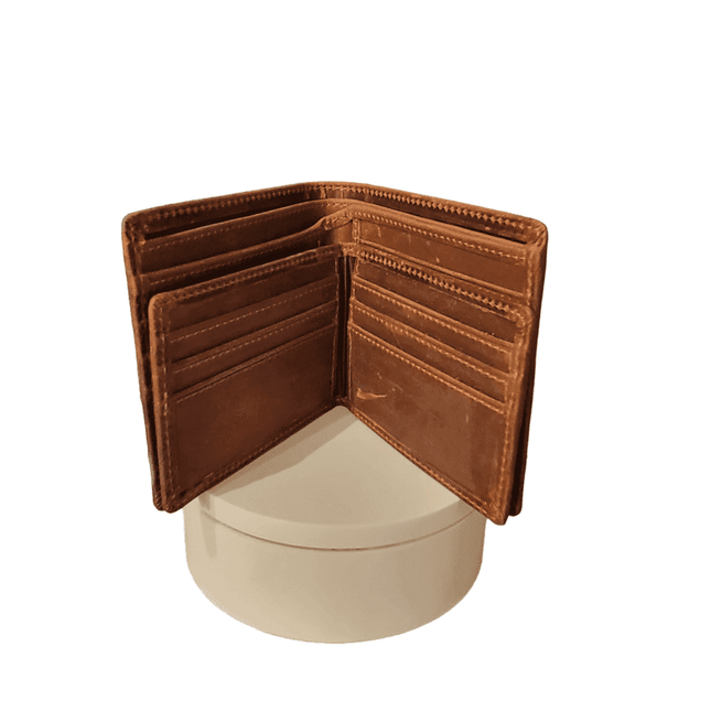 Open brown leather wallet standing on a round white pedestal