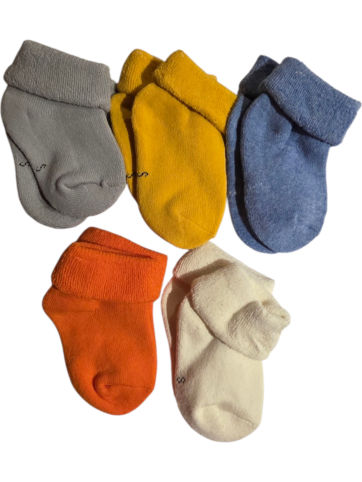 Set of cozy cotton baby socks in gray, yellow, blue, orange, and white with roll cuffs.